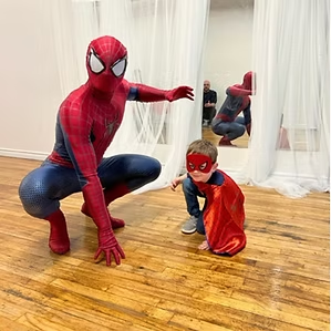 Spider-Guy with child in cape