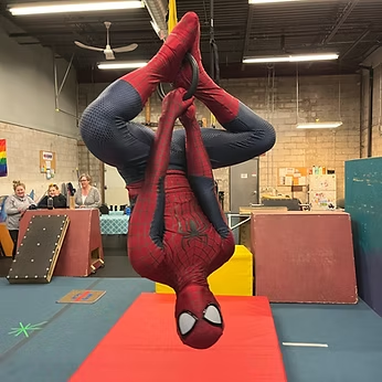 Spider-Guy hanging upside down